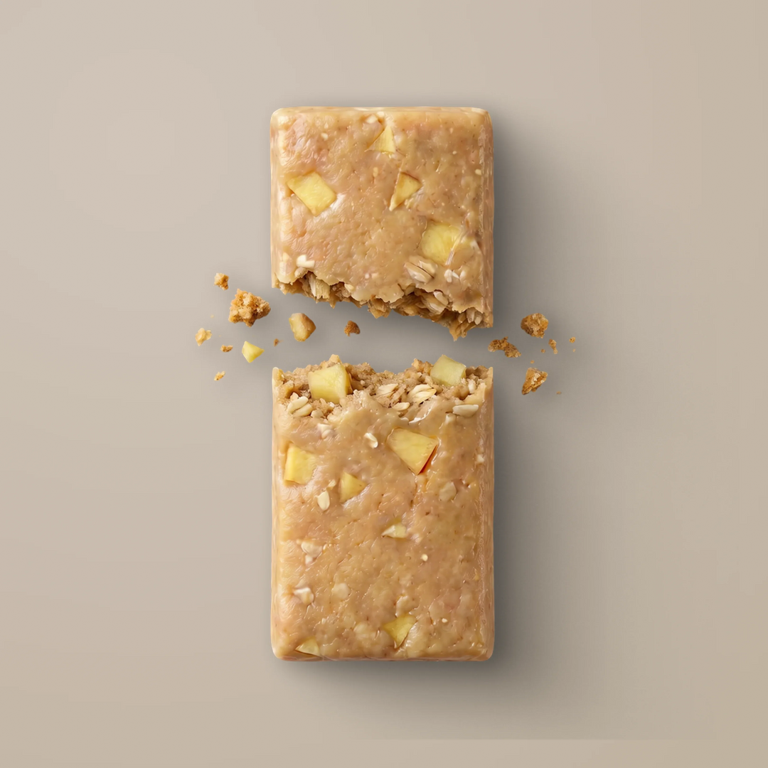 Close-up of Stars + Honey Peaches and Cream collagen protein bar texture with peach pieces