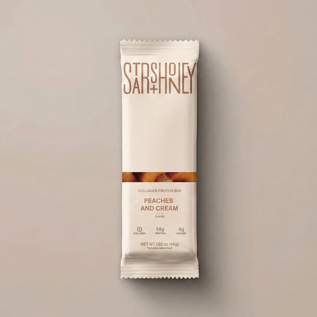 Stars + Honey Peaches and Cream collagen protein bar in white wrapper
