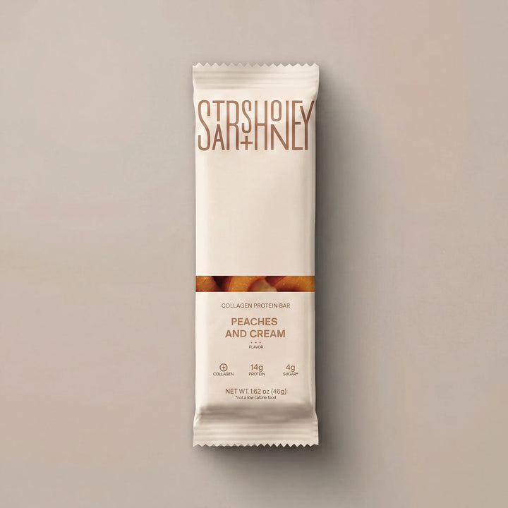 Stars + Honey Peaches and Cream collagen protein bar in white wrapper