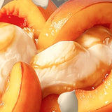 Close-up of Stars + Honey Peaches and Cream collagen protein bar flavor with fresh peaches and vanilla cream