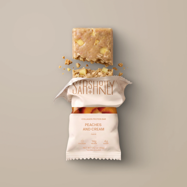 Stars + Honey Peaches and Cream collagen protein bar shown inside open wrapper