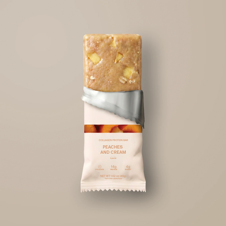 Stars + Honey Peaches and Cream collagen protein bar partially unwrapped