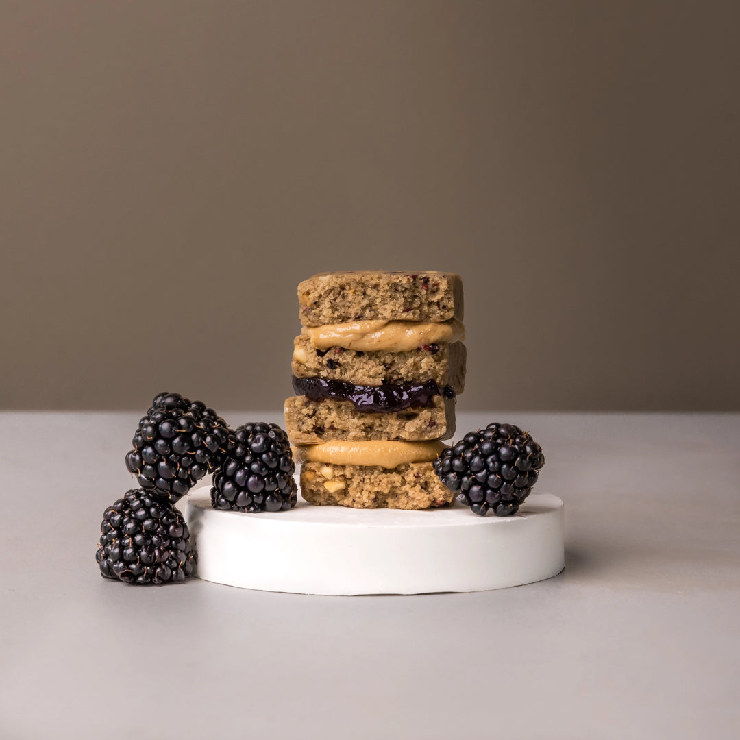Stars + Honey Peanut Butter Blackberry protein bars styled with fresh blackberries