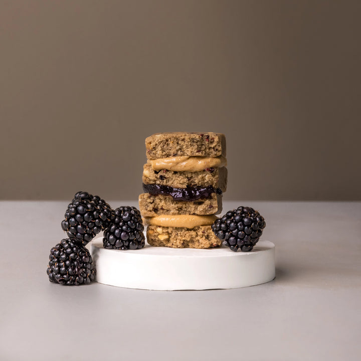 Stars + Honey Peanut Butter Blackberry protein bars styled with fresh blackberries