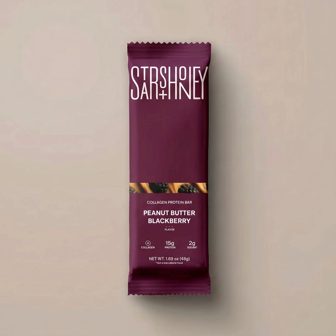 Stars + Honey Peanut Butter Blackberry collagen protein bar in blackberry wrapper