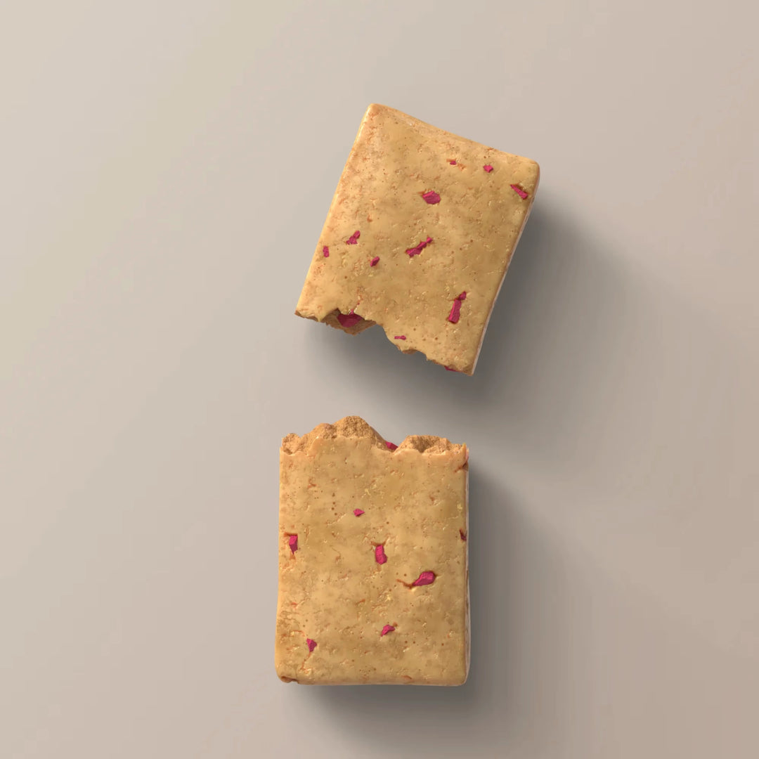 Close-up of Stars + Honey Raspberry Donut collagen protein bar pieces with raspberry