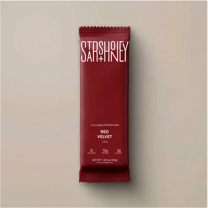 Stars + Honey Red Velvet collagen protein bar in red wrapper