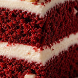 Red velvet cake with creamy vanilla frosting and white chocolate chips representing Stars + Honey Red Velvet flavor