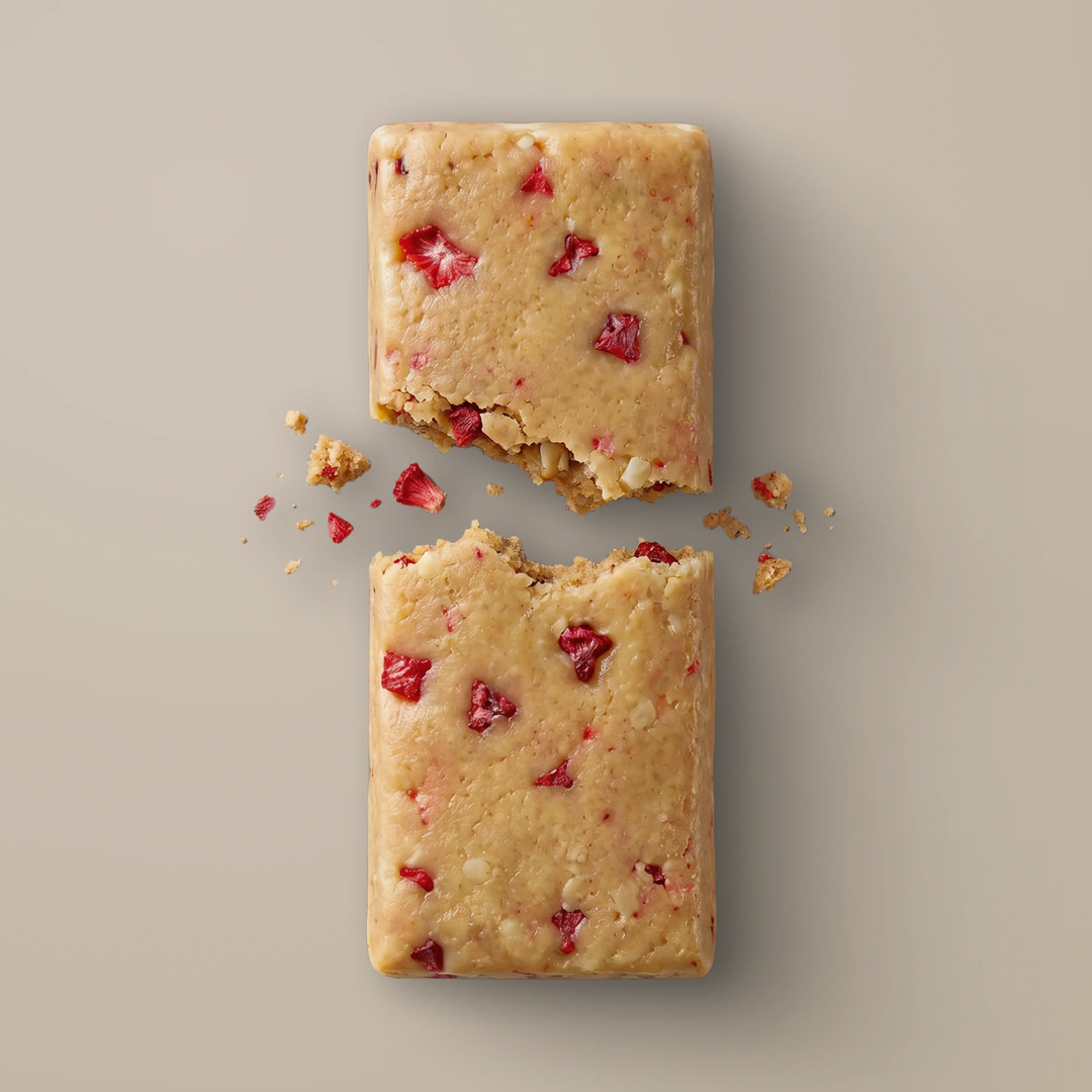 Close-up of Stars + Honey Strawberry Shortcake collagen protein bar texture with strawberry pieces