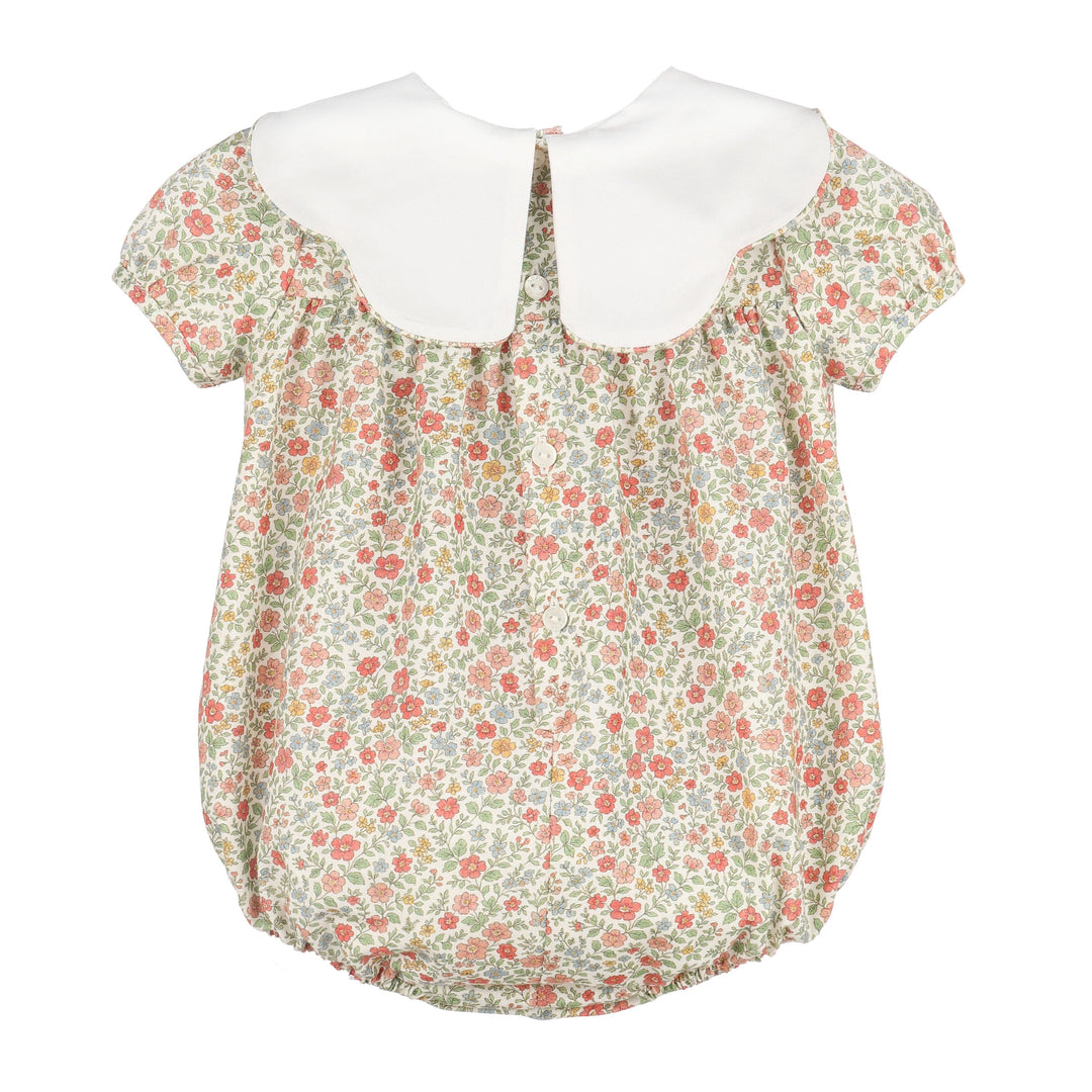 Back of Storybook Vintage Scallop Bubble with colorful floral print, white scalloped collar, and button closure