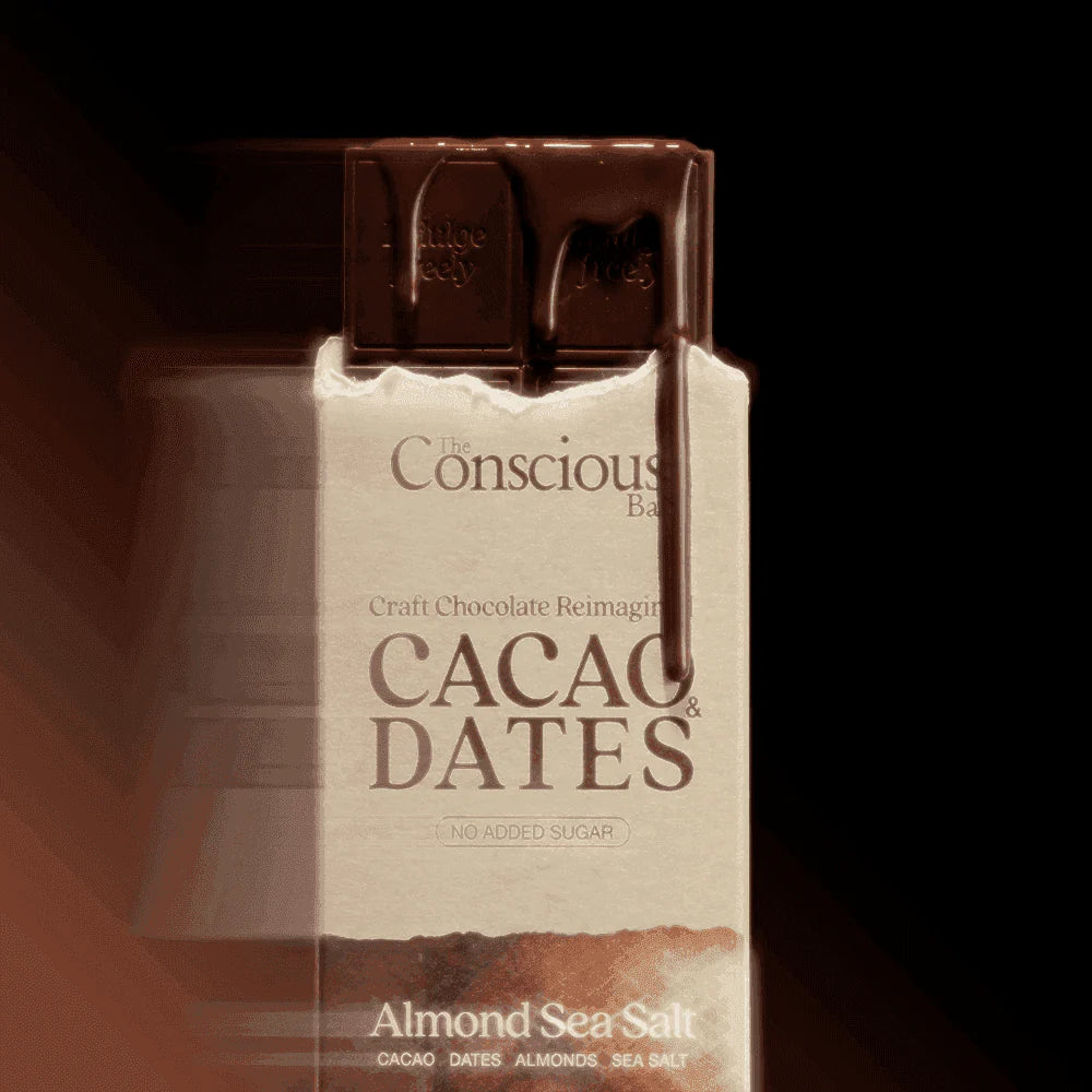 The Conscious Bar Almond Sea Salt date-sweetened dark chocolate bar and package close-up