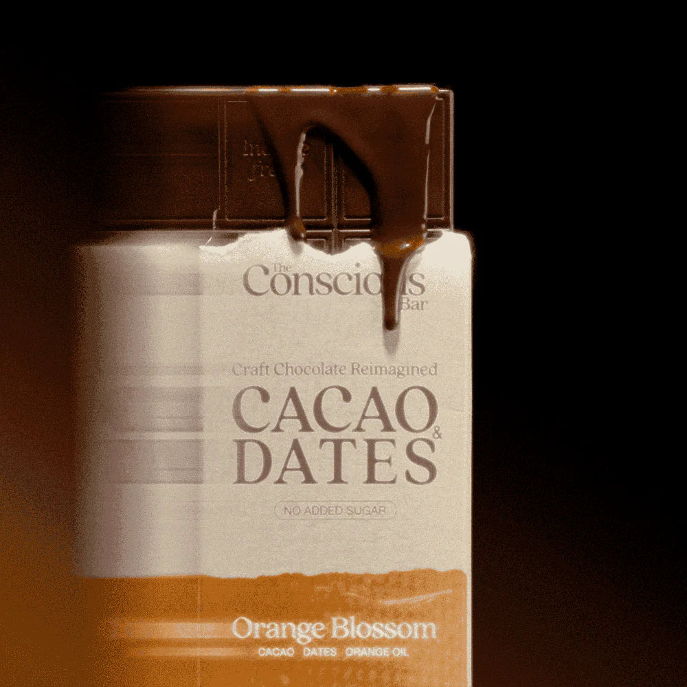 The Conscious Bar Orange Blossom dark chocolate bar with melted chocolate and no added sugar packaging