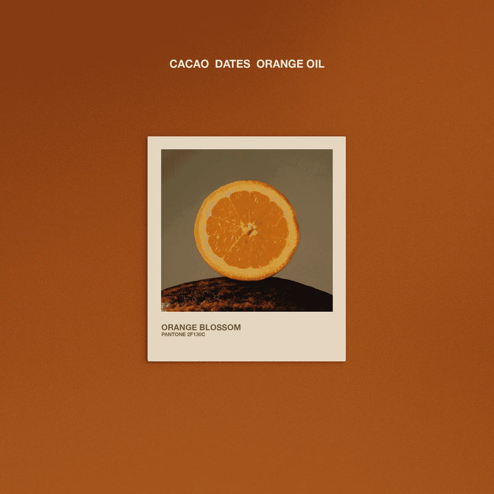 Orange Blossom flavor graphic featuring organic orange, cacao and dates for The Conscious Bar dark chocolate