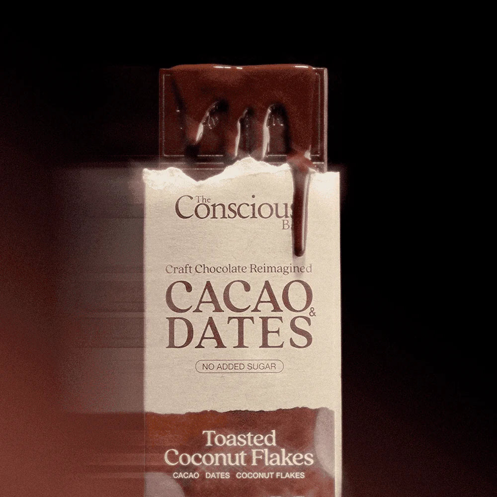 The Conscious Bar Toasted Coconut Flakes 70% dark chocolate bar sweetened with organic dates