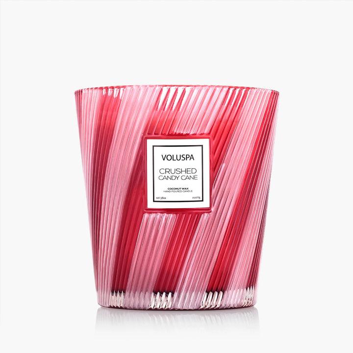 Voluspa Crushed Candy Cane 3 Wick Hearth Candle in decorative red and white striped glass vessel