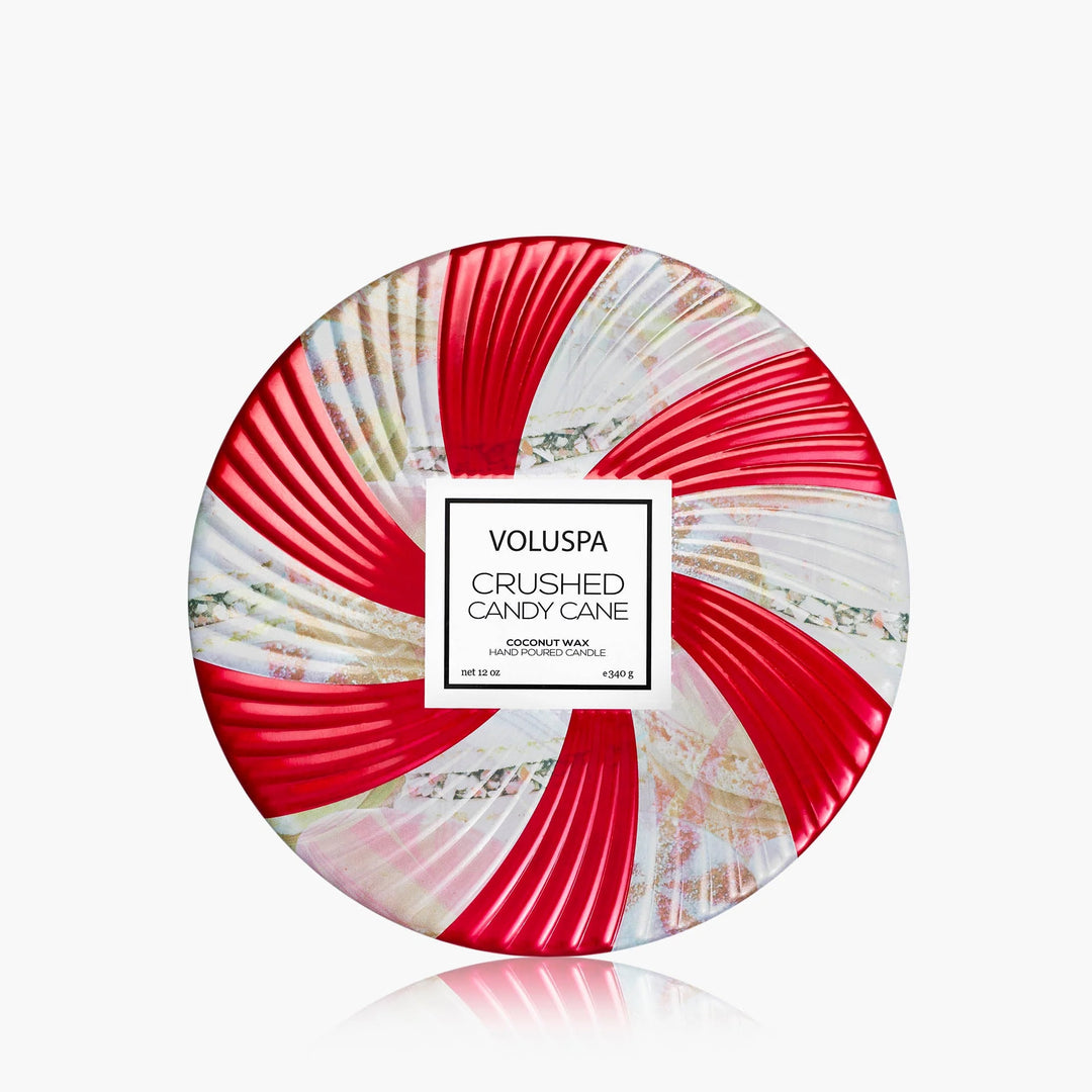 Voluspa Crushed Candy Cane 3 Wick Tin Candle with festive red and white peppermint swirl lid