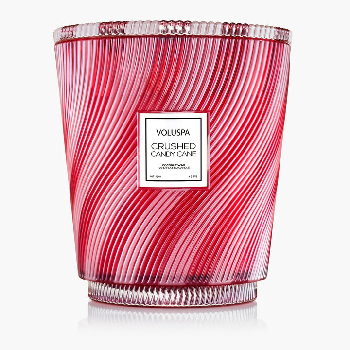 Voluspa Crushed Candy Cane 5 Wick Hearth Candle in red and white striped glass vessel with decorative lid

