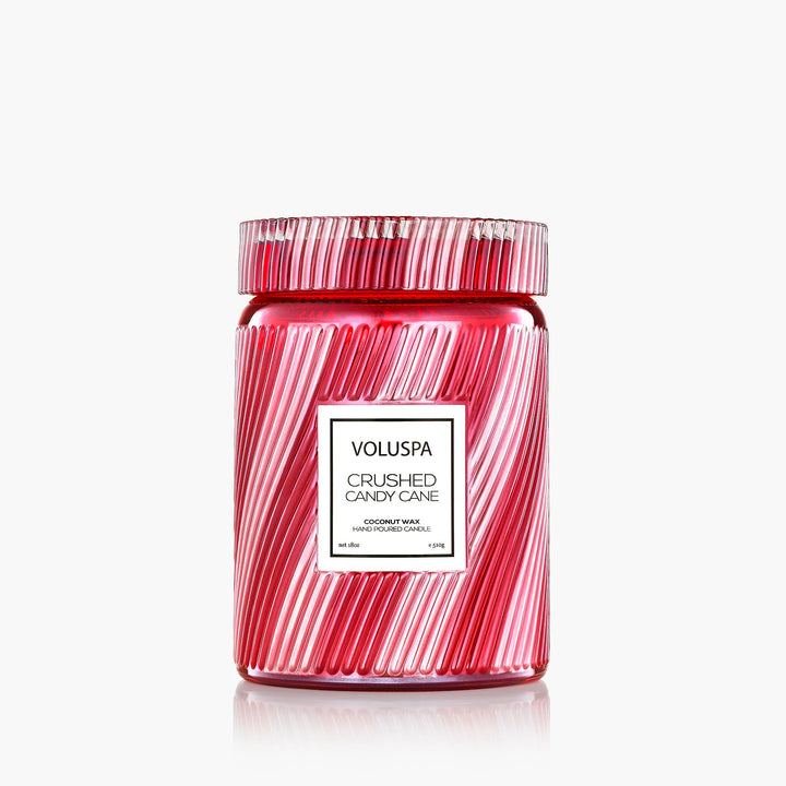 Voluspa Crushed Candy Cane Large Jar Candle in festive red and white striped glass with matching lid