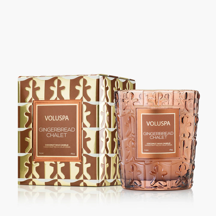 Voluspa Gingerbread Chalet Classic Candle in embossed amber glass with decorative brown and gold holiday box