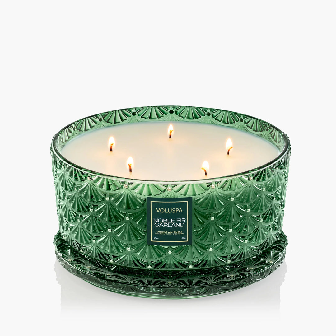 Voluspa Noble Fir Garland 65 oz Centerpiece Candle with five wicks in embossed emerald green glass