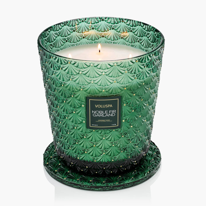 Lit Voluspa Noble Fir Garland 123 oz 5-Wick Hearth Candle in embossed emerald green glass
