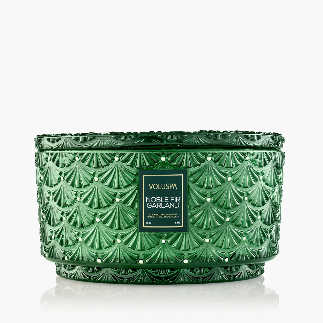 Voluspa Noble Fir Garland Centerpiece Candle in embossed emerald green glass with decorative matching lid