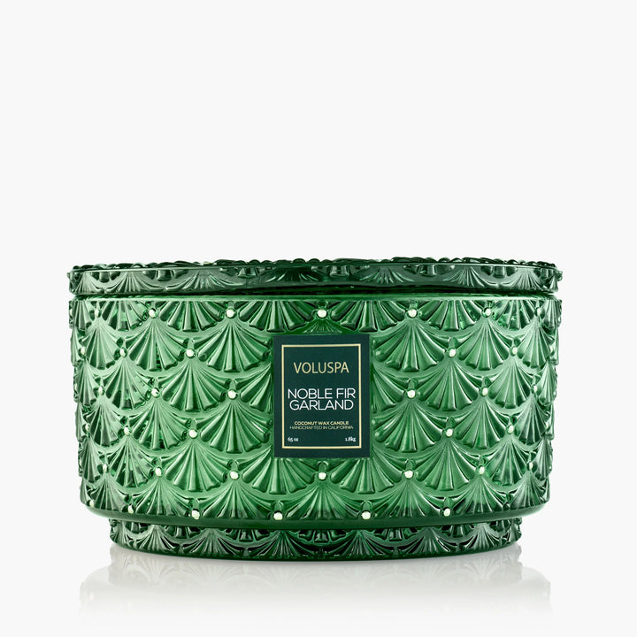 Voluspa Noble Fir Garland Centerpiece Candle in embossed emerald green glass with decorative matching lid