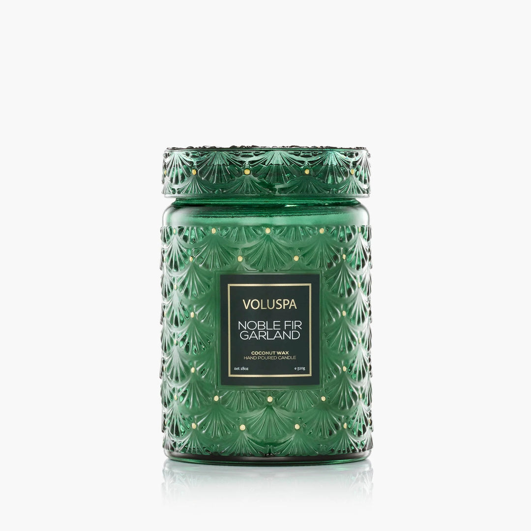 Voluspa Noble Fir Garland Large Jar Candle in embossed emerald green glass with matching decorative lid