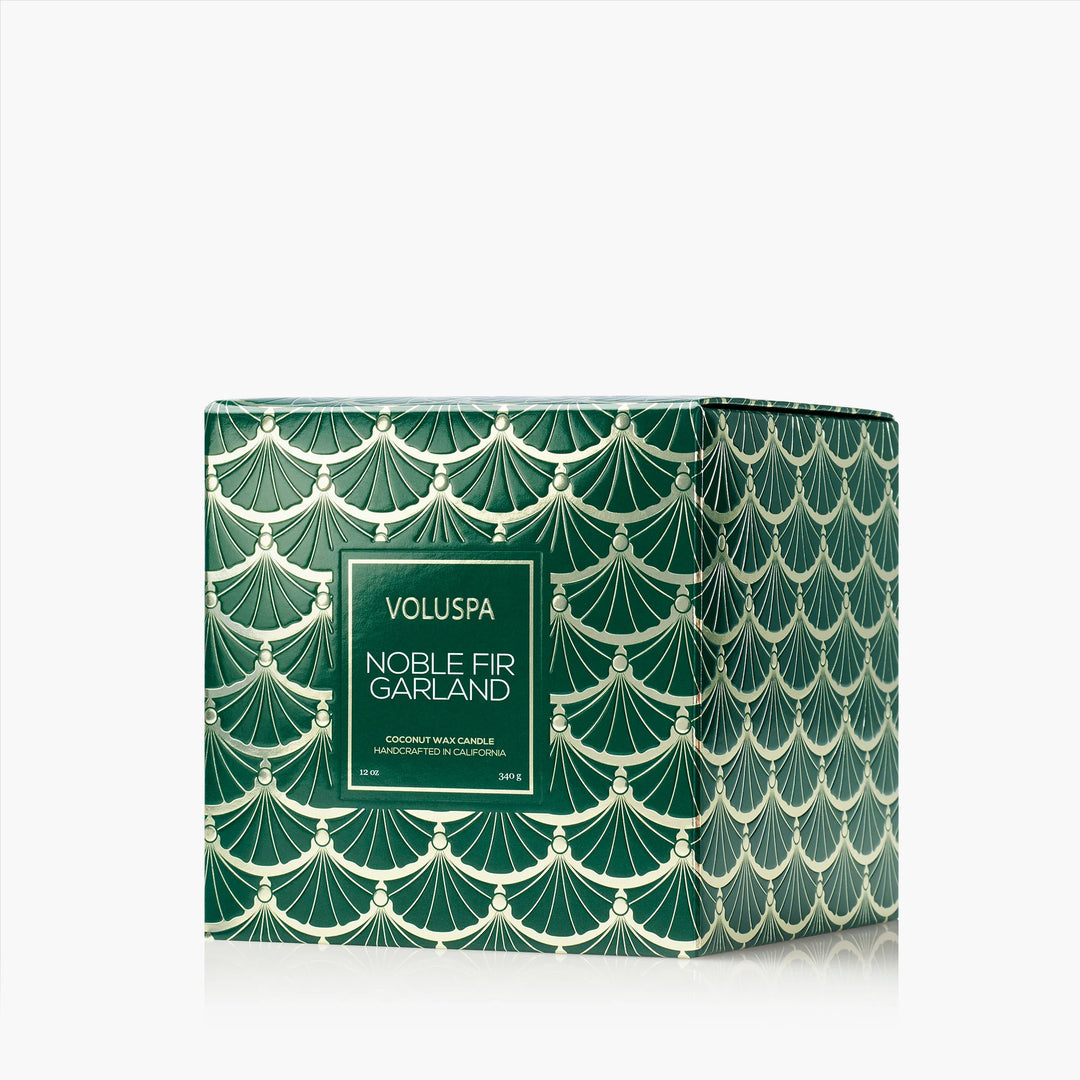 Voluspa Noble Fir Garland Luxe Classic Candle gift box featuring an emerald green and gold garland design