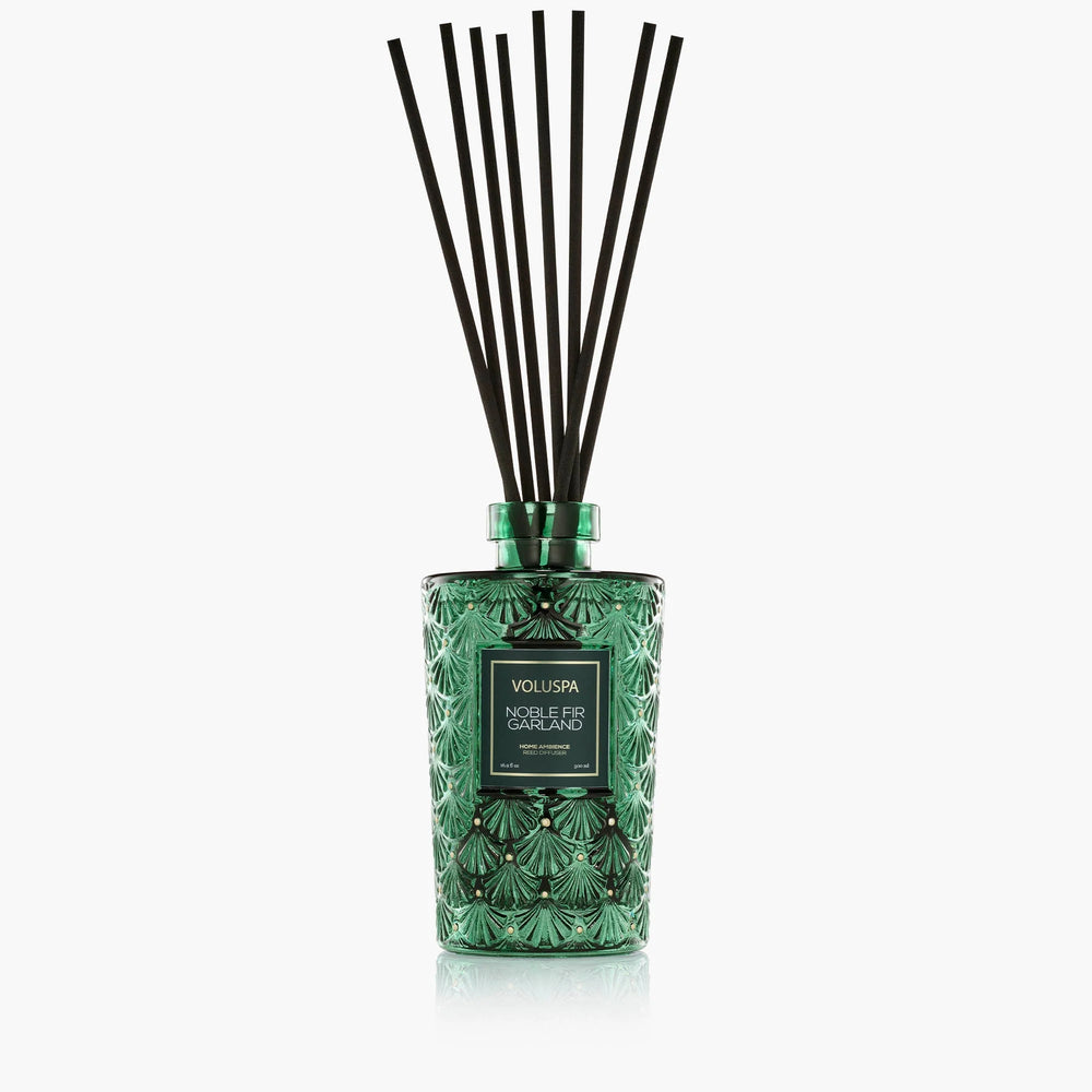 Voluspa Noble Fir Garland Luxe Reed Diffuser in embossed green glass with black fragrance reeds