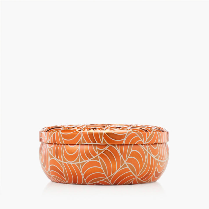 Closed Voluspa Spiced Pumpkin Latte 3 Wick Tin Candle in orange and cream patterned vessel