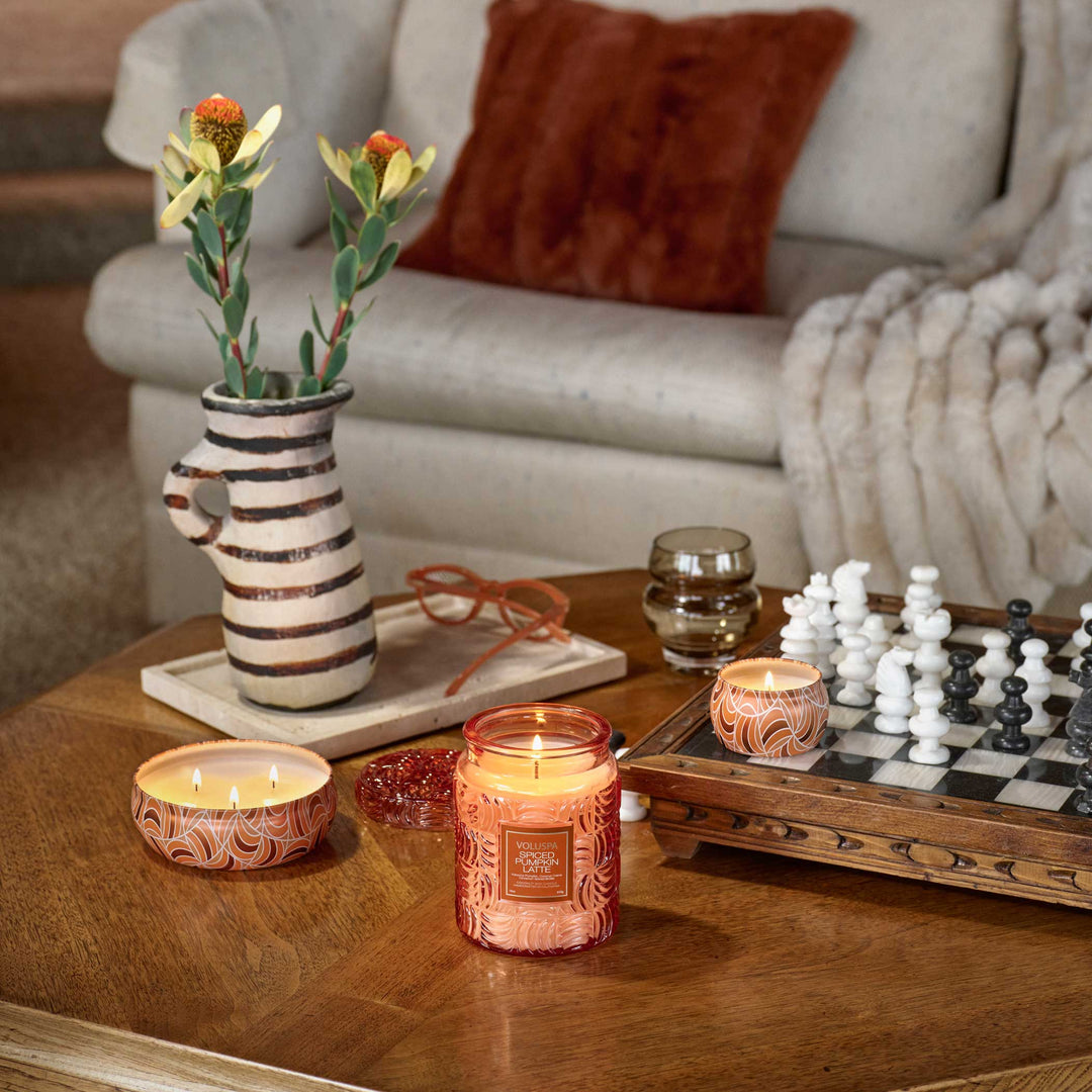 Lit Voluspa Spiced Pumpkin Latte Large Jar Candle styled with pumpkin, cinnamon sticks and a latte