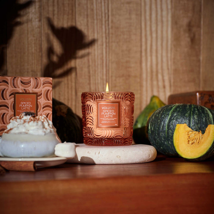 Lit Voluspa Spiced Pumpkin Latte Luxe Classic Candle styled with pumpkin and fall décor