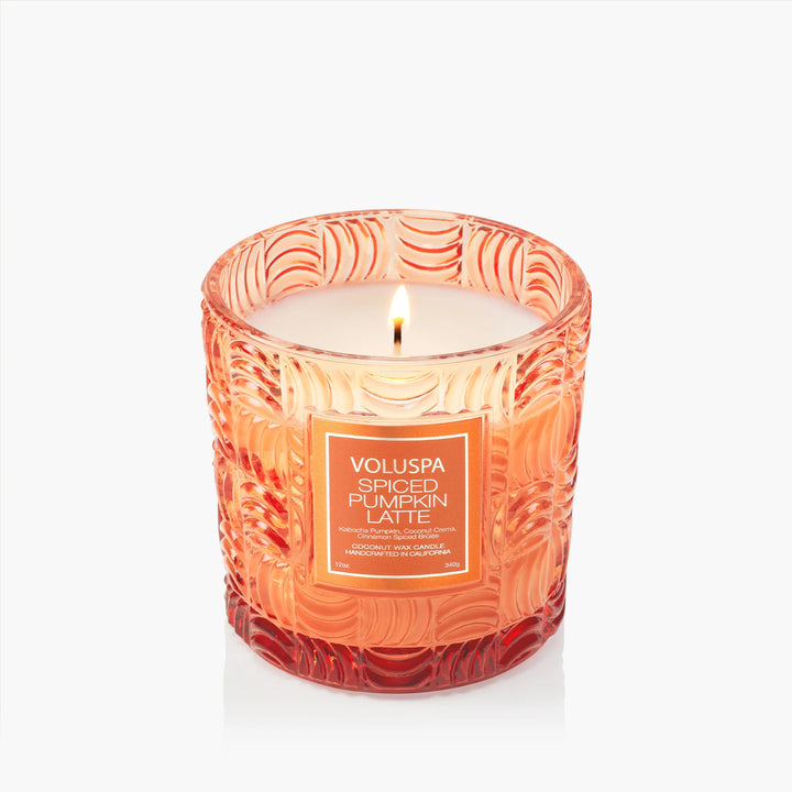 Lit Voluspa Spiced Pumpkin Latte Luxe Classic Candle in embossed orange glass vessel