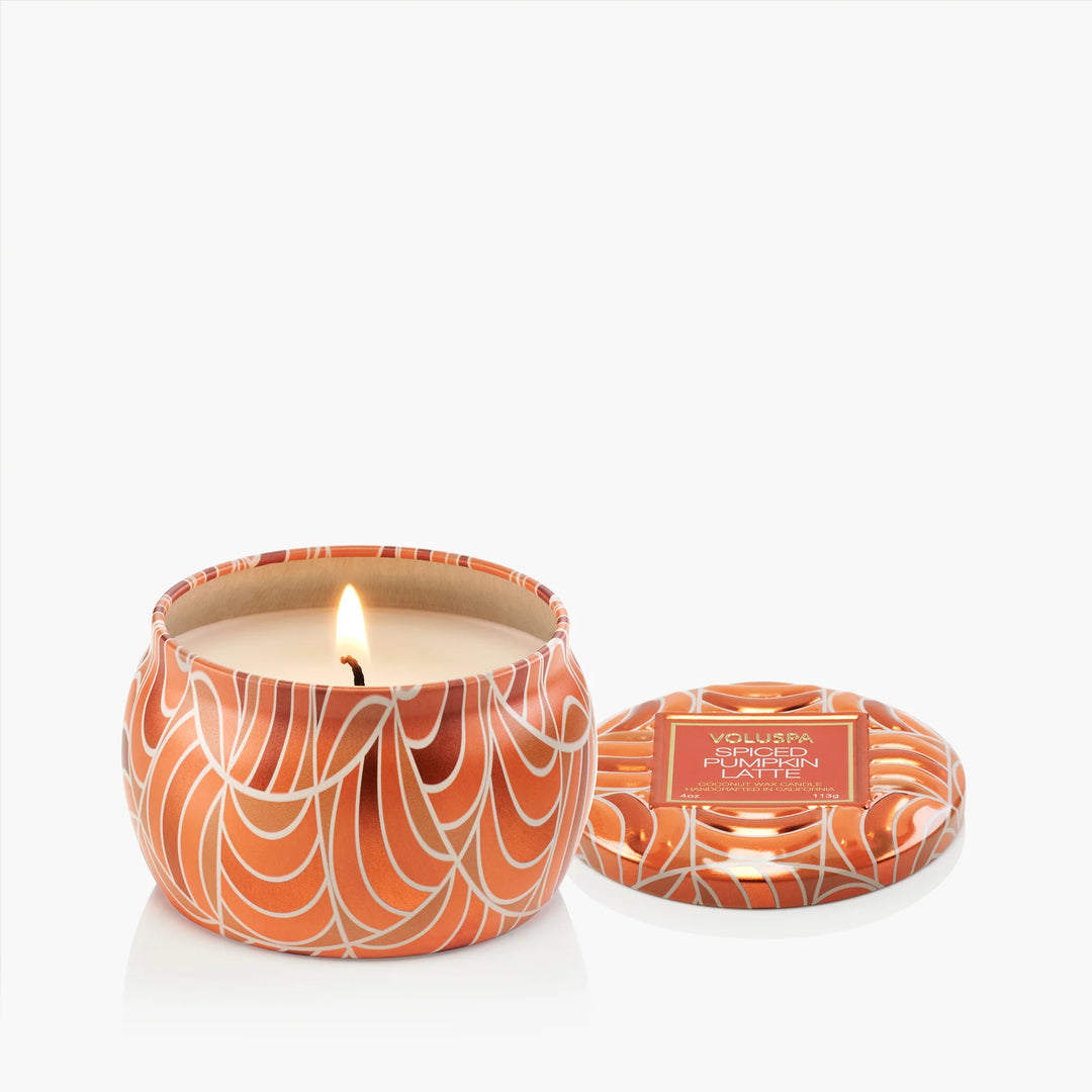 Open Voluspa Spiced Pumpkin Latte Mini Tin Candle with lit wick and coordinating decorative lid