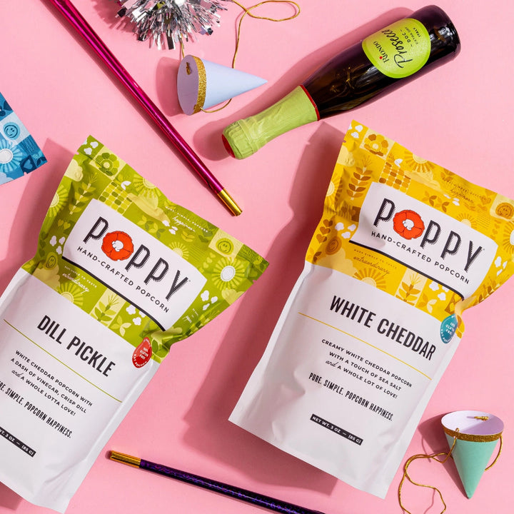 Poppy White Cheddar Hand-Crafted Popcorn and Dill Pickle Popcorn at a colorful party