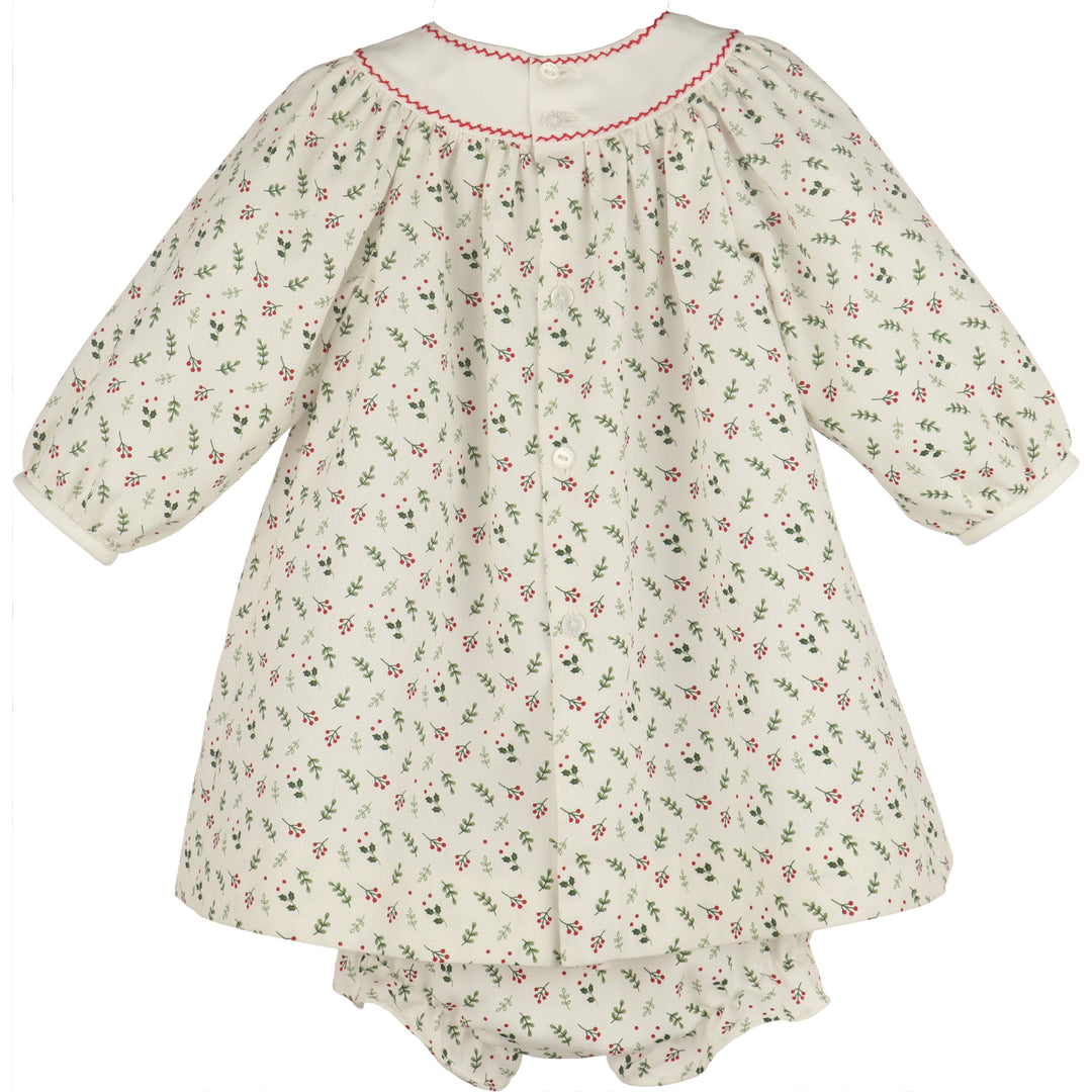 Back view of White Mistletoe Dress Set for baby girls with red trim, button-back closure, holiday print, and matching bloomers