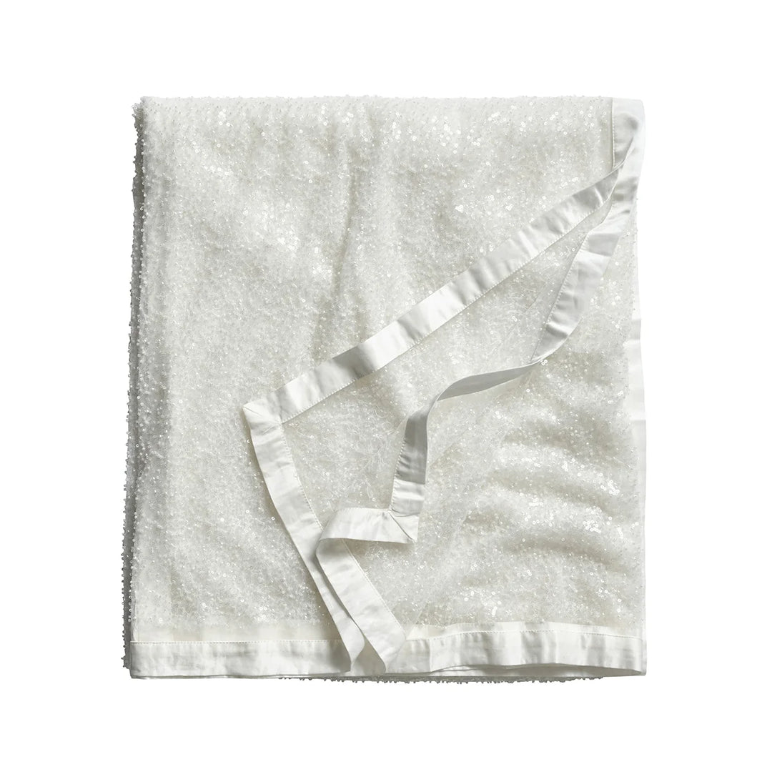 White sequin tablecloth featuring shimmering allover sequins and an elegant white satin border