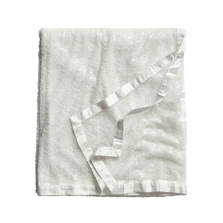 White sequin tablecloth featuring shimmering allover sequins and an elegant white satin border